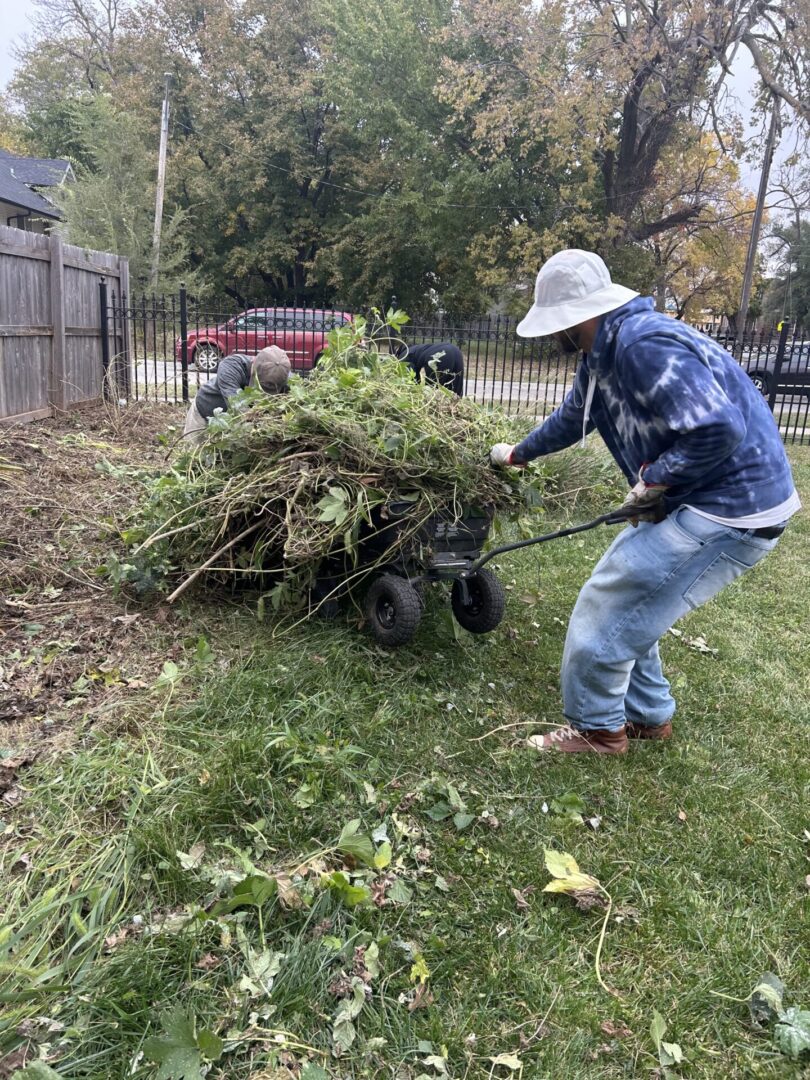 Volunteers remove branches at a Community Cleanup